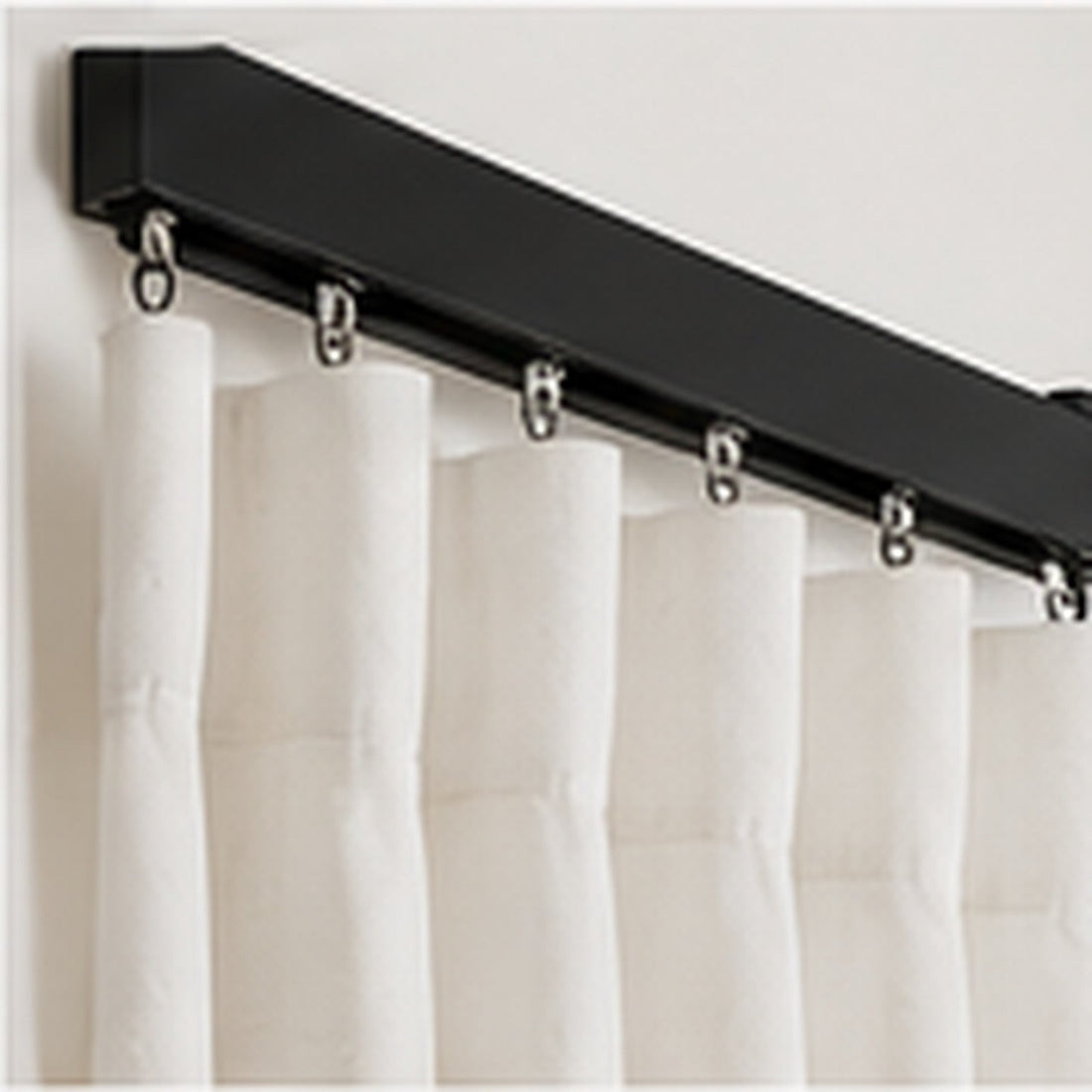 Matt black curtain track with gliders