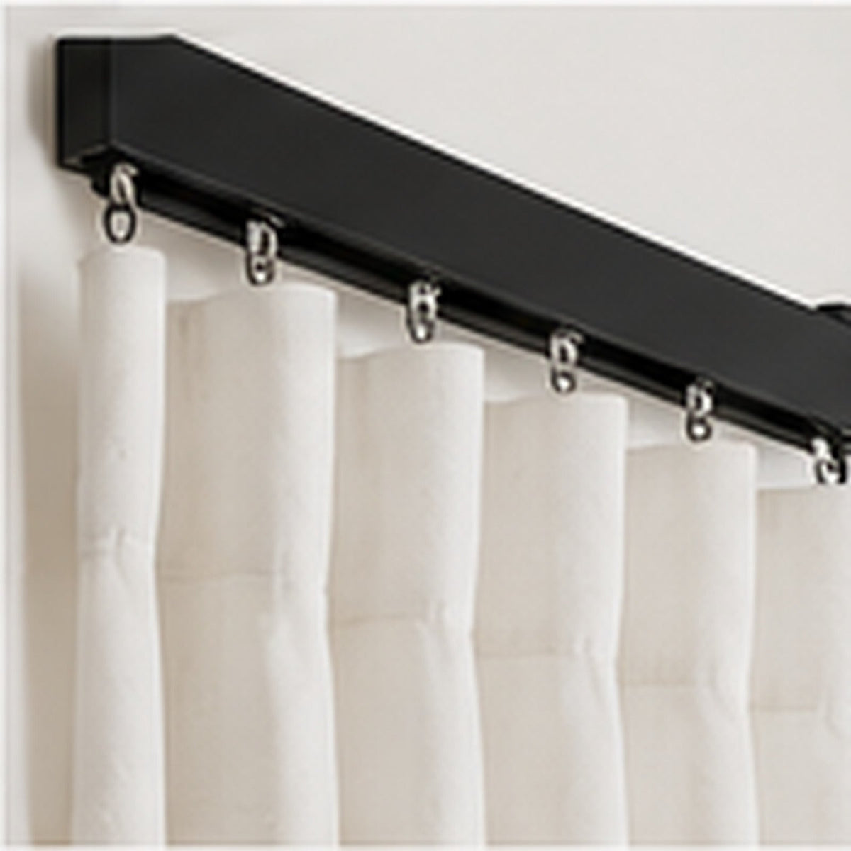 Matt black curtain track with gliders