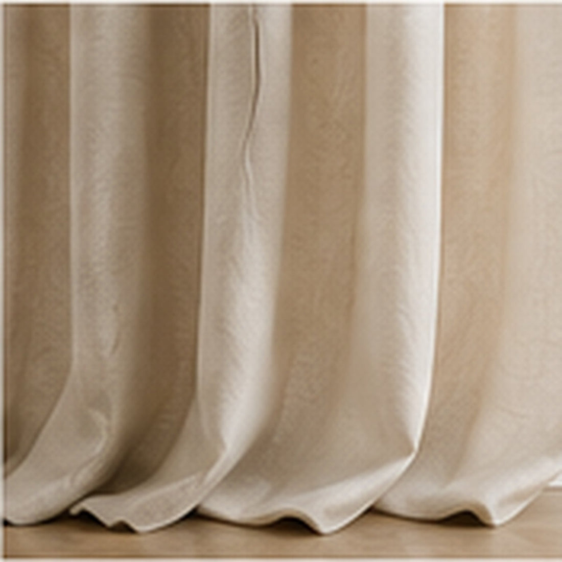 Lined cream curtains hanging in deep folds