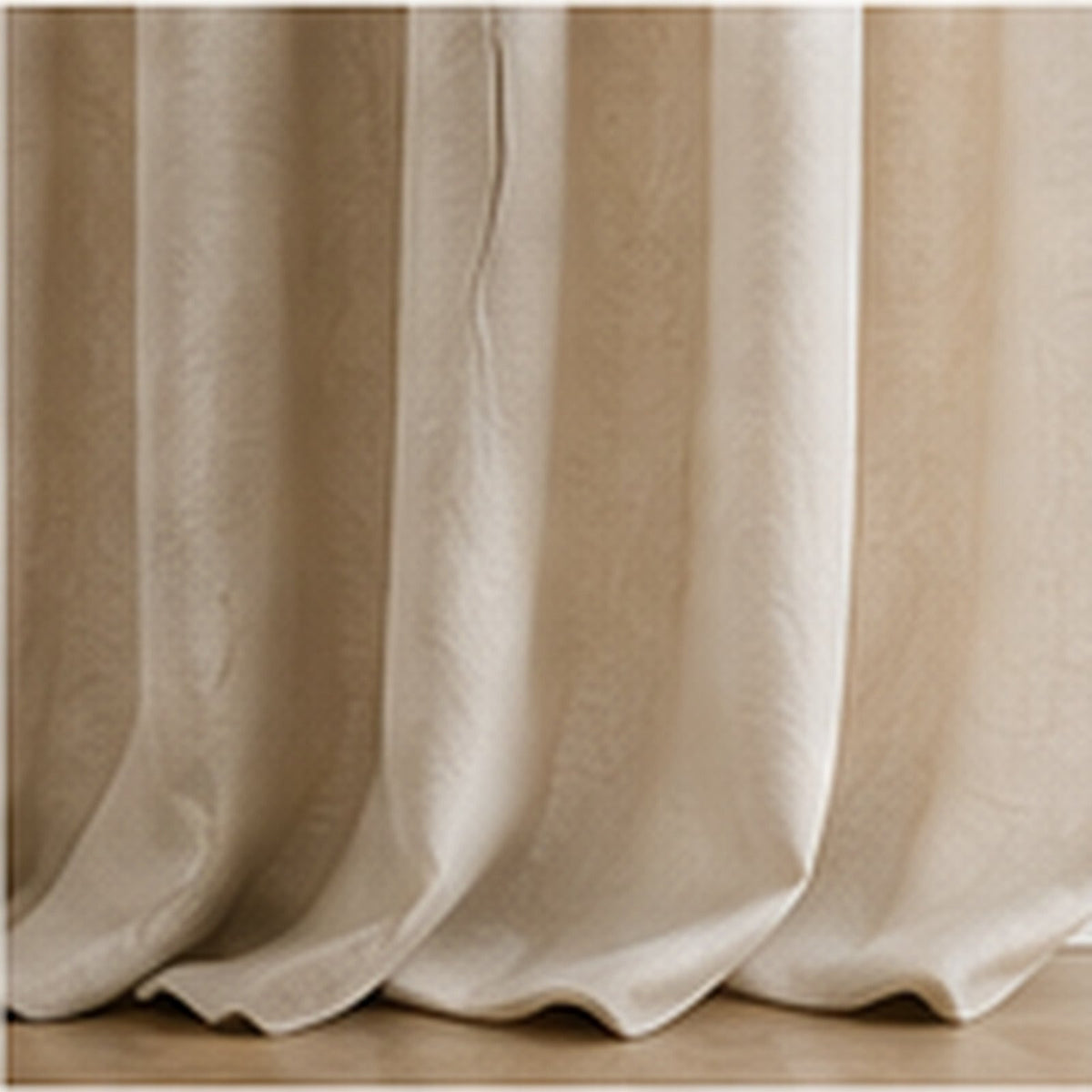 Lined cream curtains hanging in deep folds