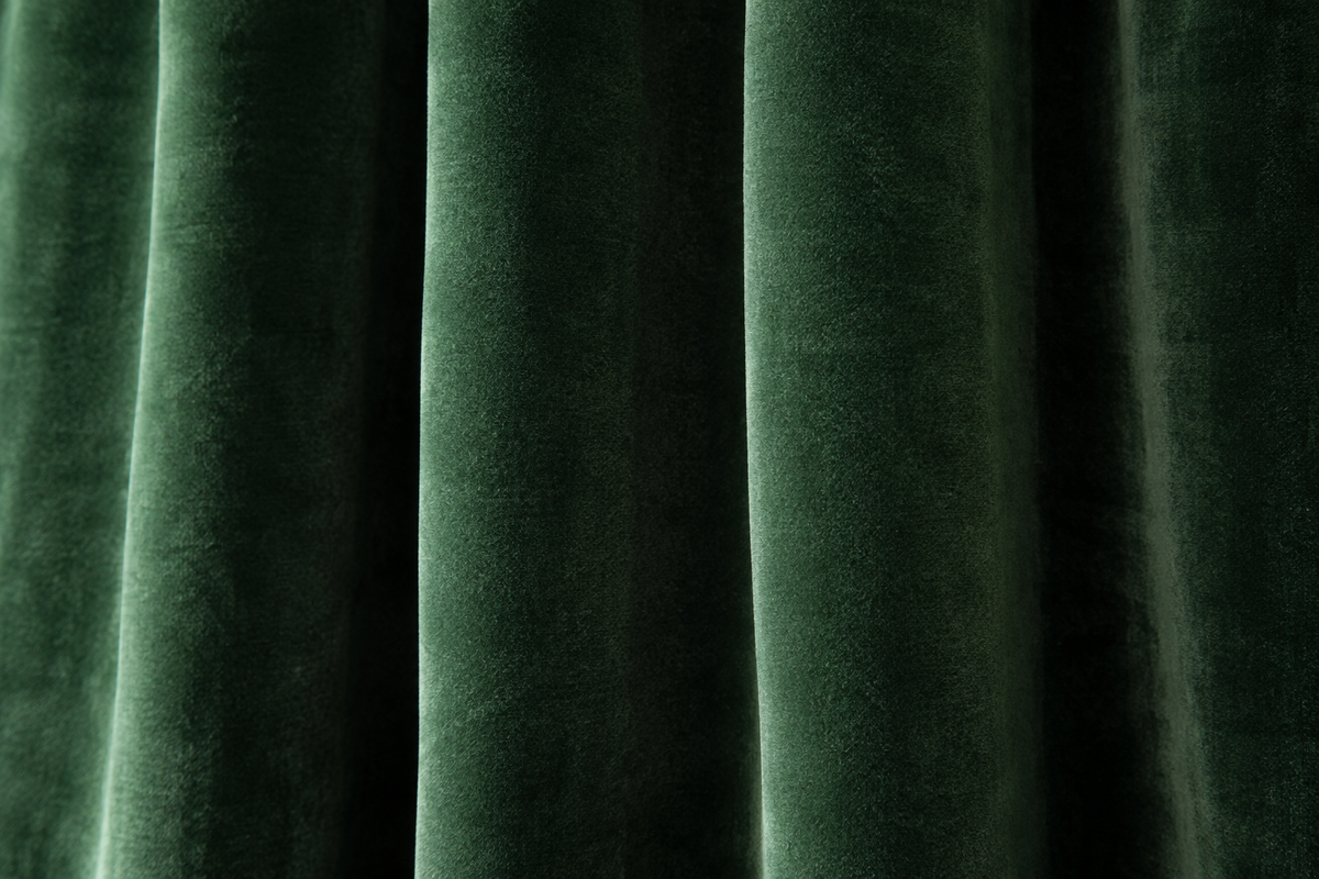 Close-up of velvet curtain fabric showing texture and drape
